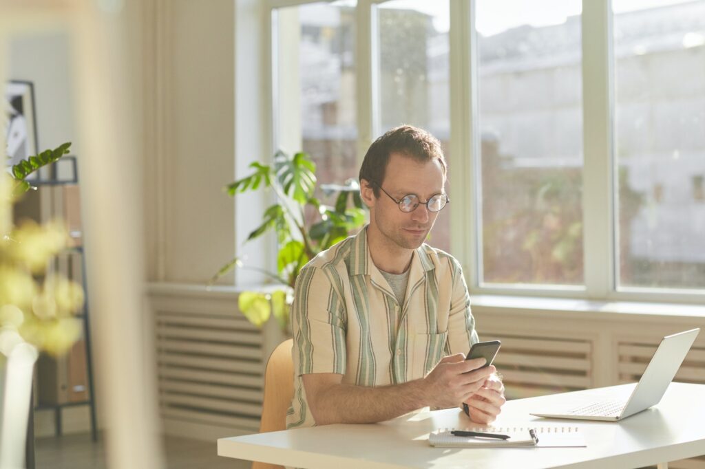 Man Watching Something On Smartphone